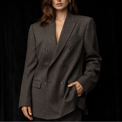 Woman modelling a gray Giorgio Armani Double-Breasted Jacket against a black background.