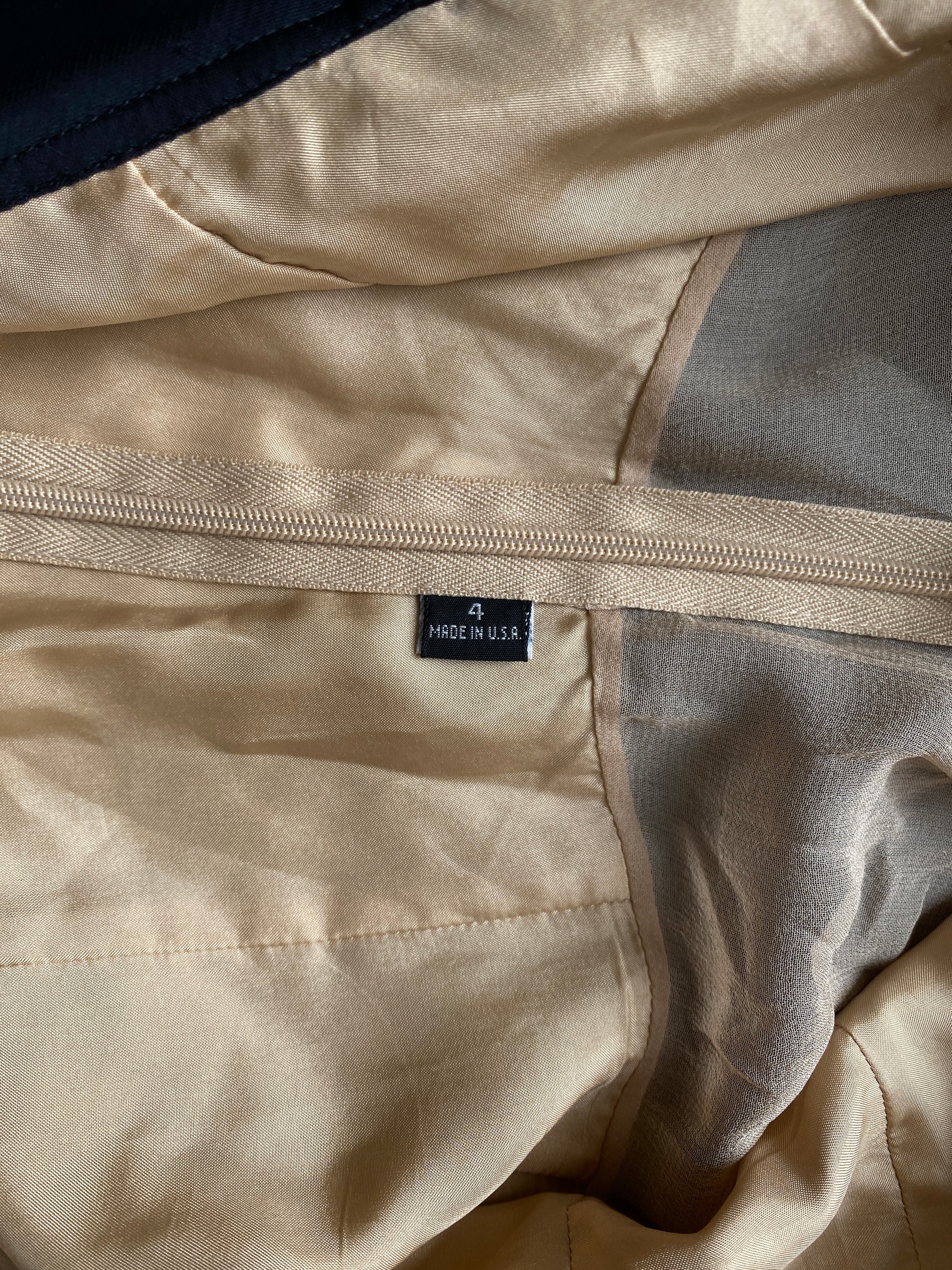 Close-up of the beige interior of the Isabel Toledo Sculptural Taffeta Dress. 