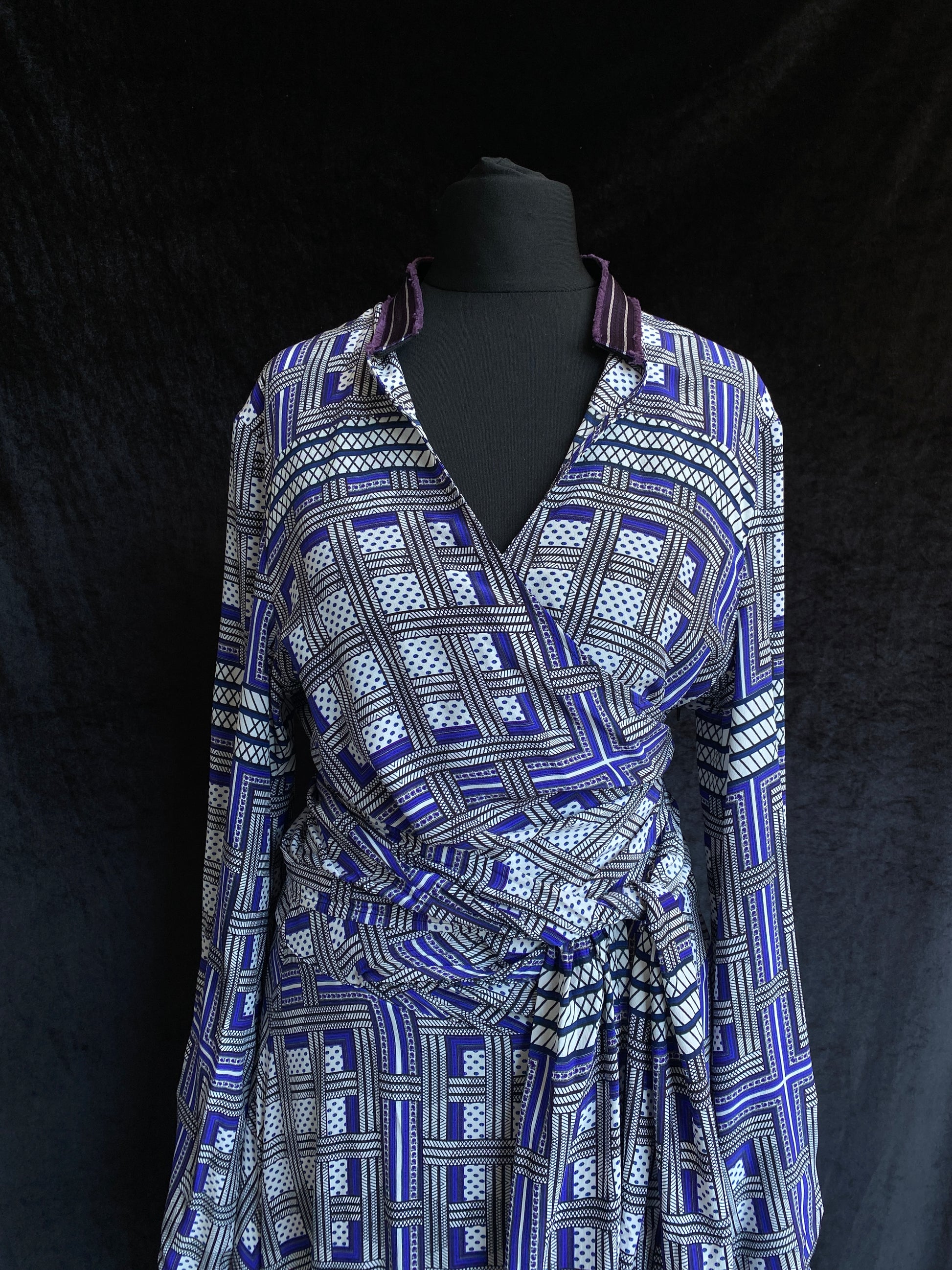 Amanda Wakeley Silk Wrap Dress geometric print in shades of blue black background.