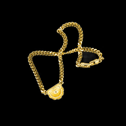 The back of the Swarovski Gold Chain Necklace with Ruby Red Crystal Pendant on a black background.