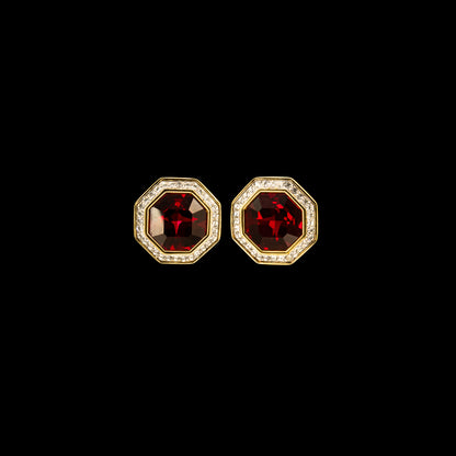 Swarovski Octagonal Earrings, Ruby Red Crystals in the centre with gold accents on a black background.