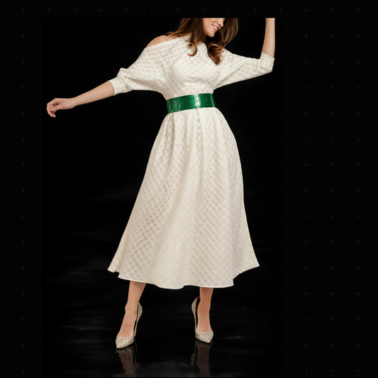 Woman wearing a Ralph & Russo “Snow White” Cut-Out Dress with a green belt on a black background.