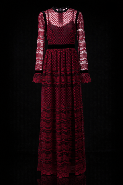 Woman modelling a Philosophy di Lorenzo Seraphini burgundy long sleeve gown dress against a black background.