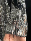 A close up of the material on the Roland Mouret Asymmetric Sequin Gown.