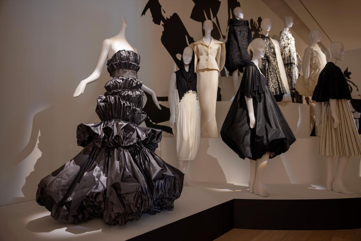 Mannequins wearing various Isabel Toledo outfits in a display setting. One of the outfits includes the Sculptural Taffeta Dress.